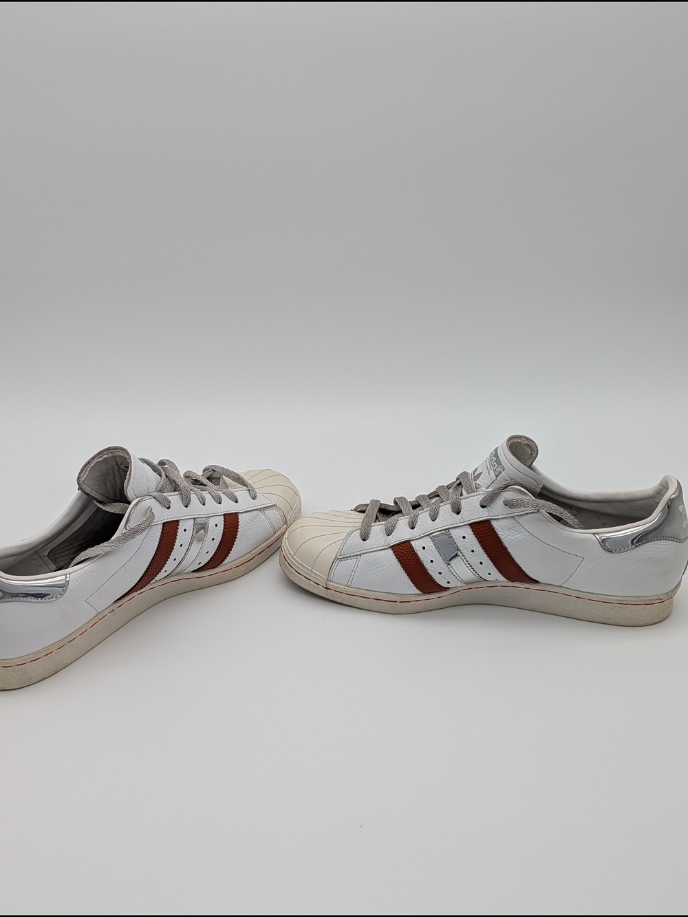 adidas White Sneakers with Brown Stripe Accents